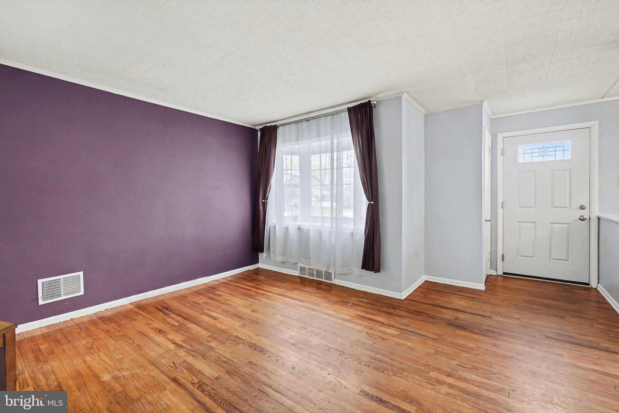 1309 Kingsley Road Camp Hill, PA 17011 - Photo 5 of 30 a view of empty room with wooden floor and fan