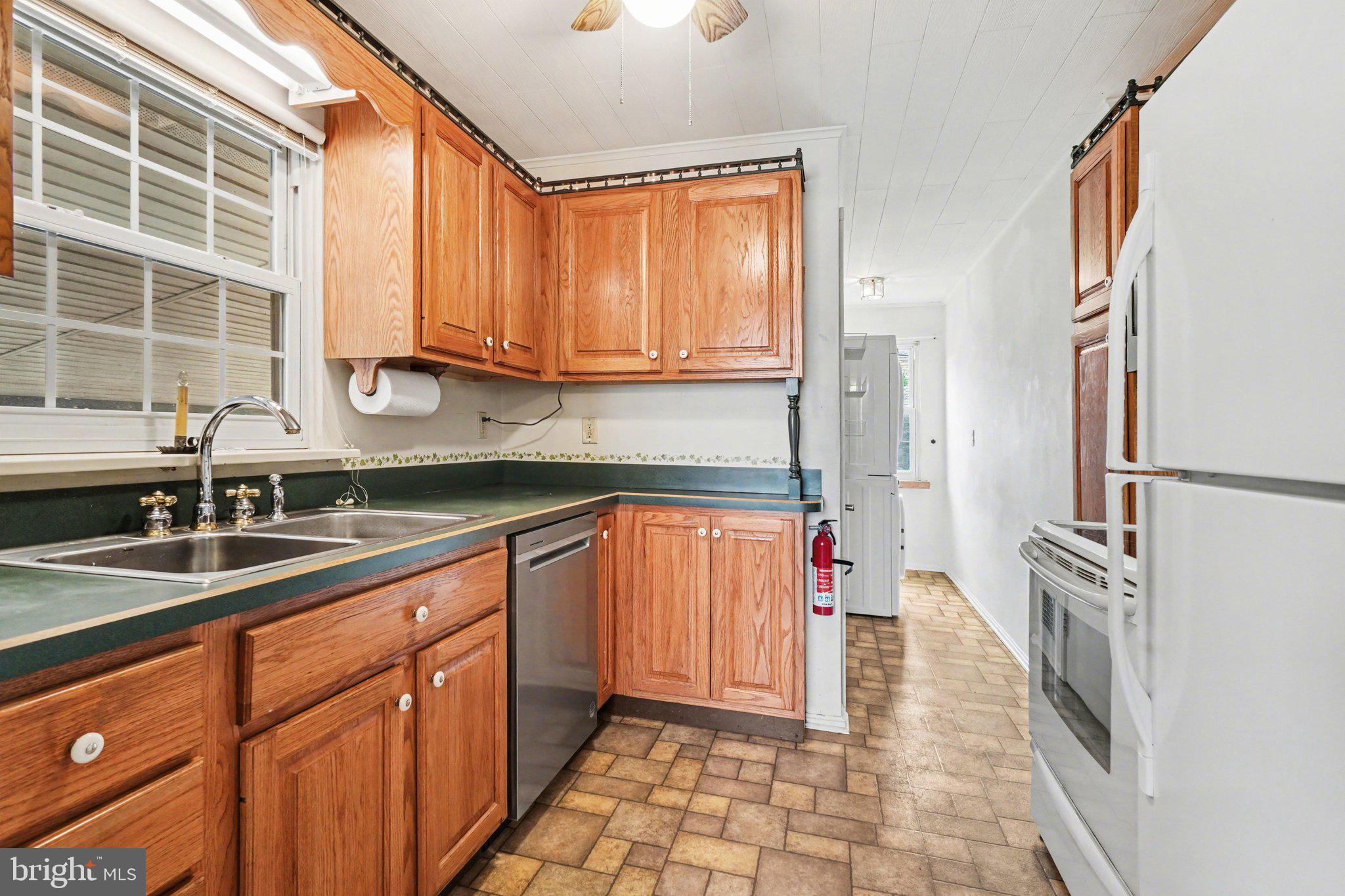 1309 Kingsley Road Camp Hill, PA 17011 - Photo 10 of 30 a kitchen with stainless steel appliances granite countertop a refrigerator and a sink