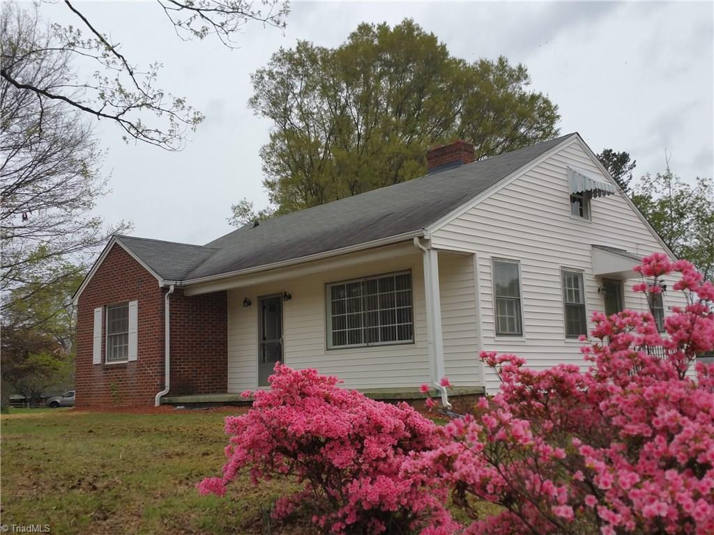 Beautiful azaleas and flowering dogwoods complement this updated older home.  Vinyl Siding with Brick accent front has been freshly pressure washed.  