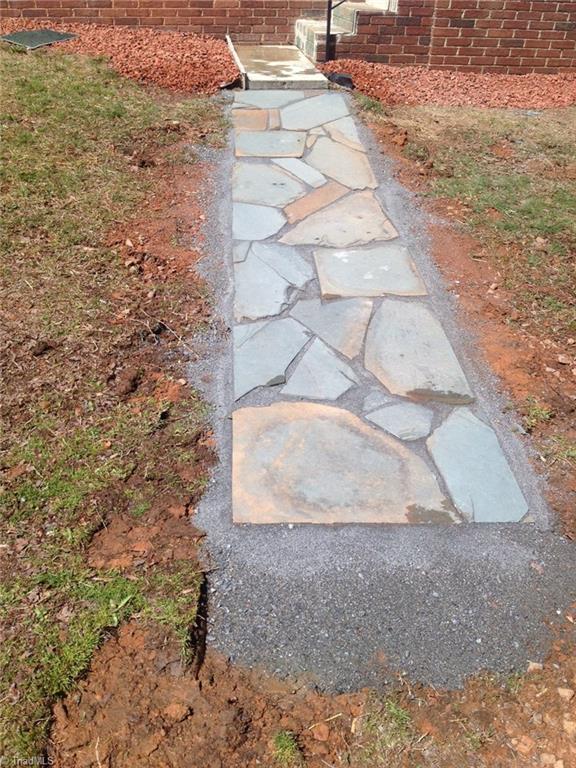 855 Reynolds Road Lewisville, NC 27023 - Photo 17 of 17 New sidewalk to side/kitchen door