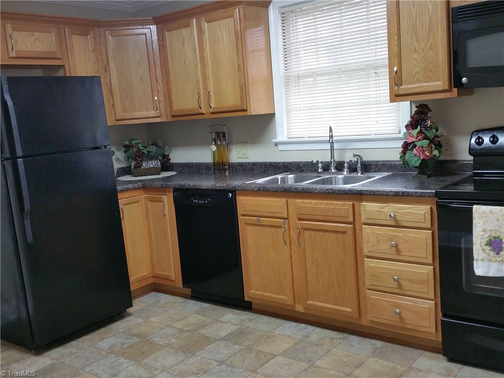 855 Reynolds Road Lewisville, NC 27023 - Photo 10 of 17 Updated kitchen with all new appliances, cabinets, countertop and sink.