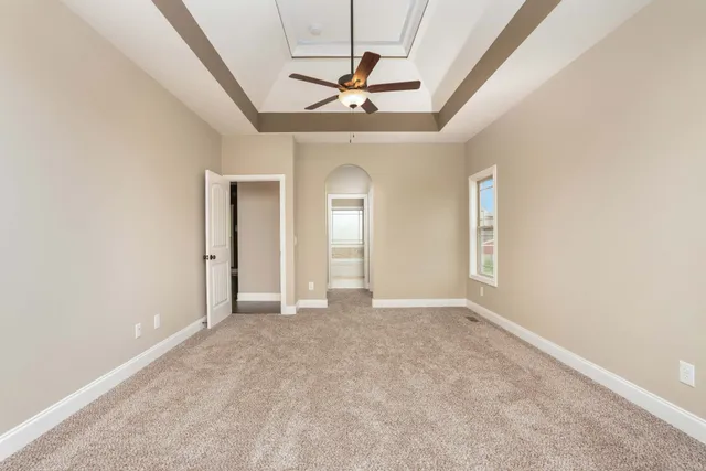 a view of empty room with ceiling fan