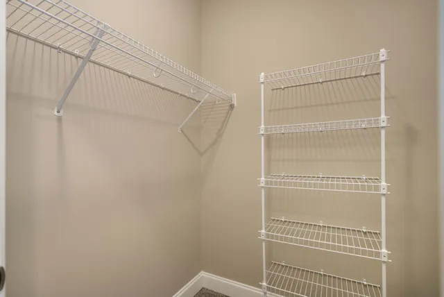 a view of a room with racks on the wall