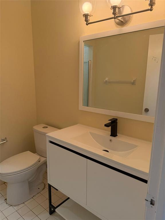 7410 Woodmont Terrace, Unit 207 Tamarac, FL 33321 - Photo 11 of 20 a bathroom with a sink and a toilet