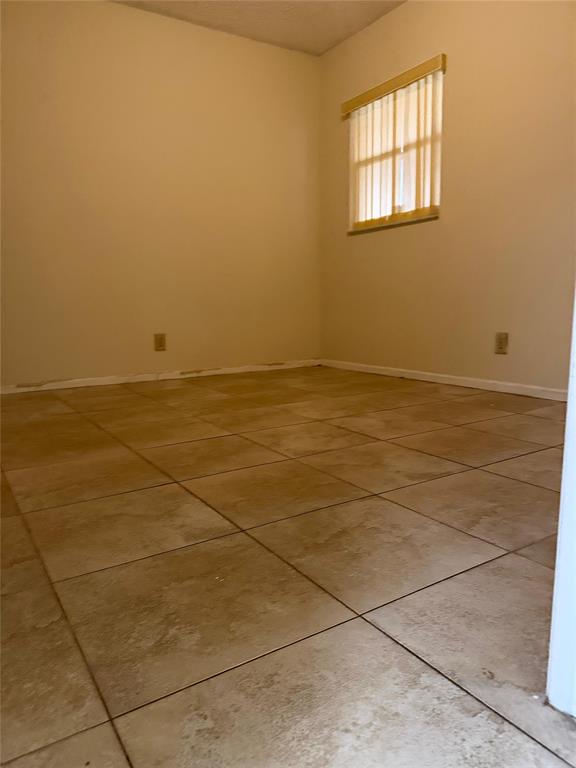 7410 Woodmont Terrace, Unit 207 Tamarac, FL 33321 - Photo 13 of 20 a view of an empty room and window