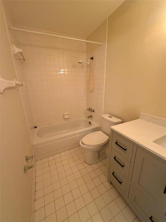 7410 Woodmont Terrace, Unit 207 Tamarac, FL 33321 - Photo 17 of 20 a bathroom with a granite countertop sink a toilet and shower