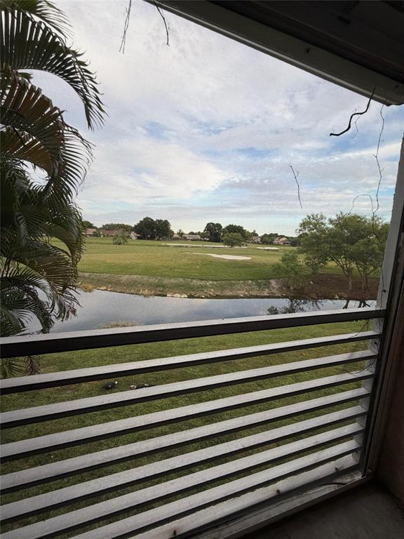 7410 Woodmont Terrace, Unit 207 Tamarac, FL 33321 - Photo 20 of 20 a view of a balcony with an ocean view