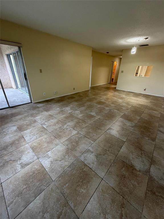 7410 Woodmont Terrace, Unit 207 Tamarac, FL 33321 - Photo 6 of 20 a view of an empty room