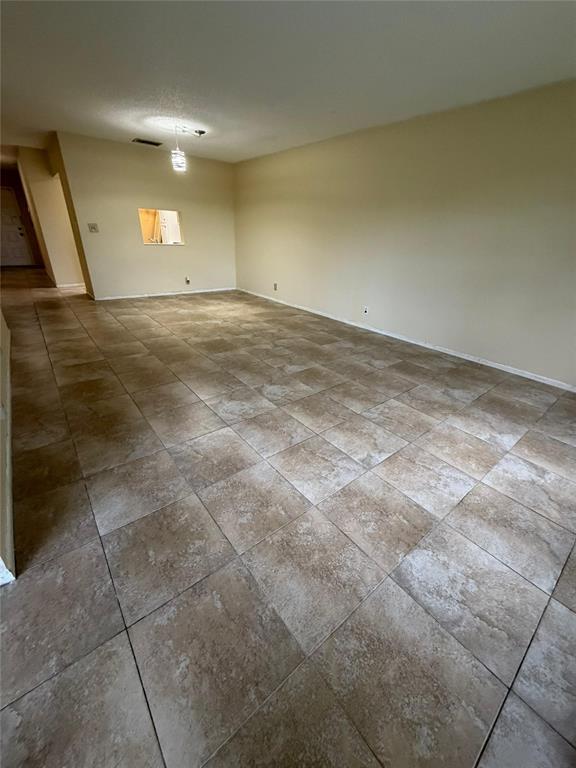 7410 Woodmont Terrace, Unit 207 Tamarac, FL 33321 - Photo 7 of 20 a view of an empty room