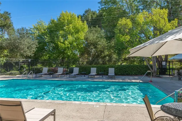 a backyard of a house with yard and outdoor seating