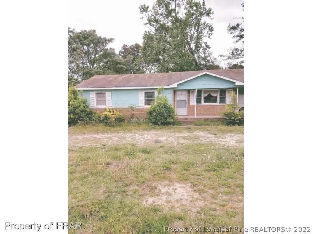 3913 Cumberland Road Fayetteville, NC 28306 - Photo 1 of 13 a view of a house with a yard