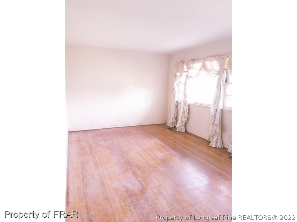 3913 Cumberland Road Fayetteville, NC 28306 - Photo 3 of 13 a view of an empty room with a window