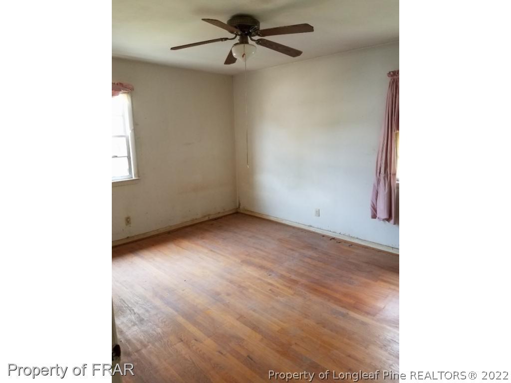 3913 Cumberland Road Fayetteville, NC 28306 - Photo 4 of 13 a view of an empty room with a window