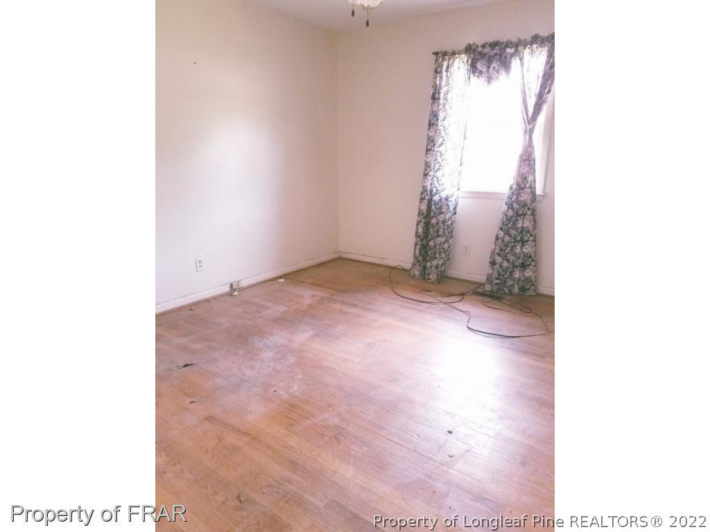 3913 Cumberland Road Fayetteville, NC 28306 - Photo 8 of 13 a view of empty room with windows