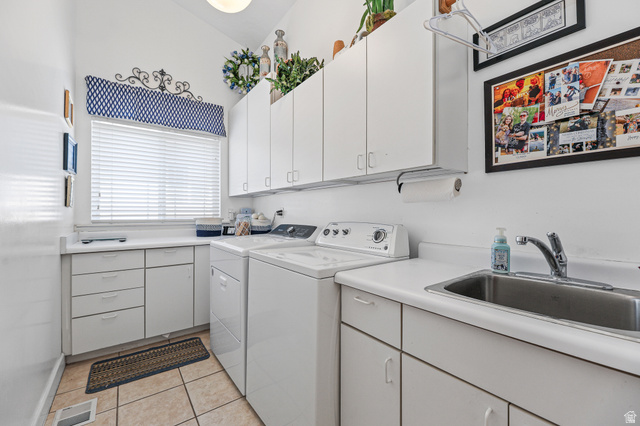 31 Village Square Road Centerville, UT 84014 - Photo 15 of 29 Bright utility room featuring ample white cabinetry, integrated sink, and a window with white blinds