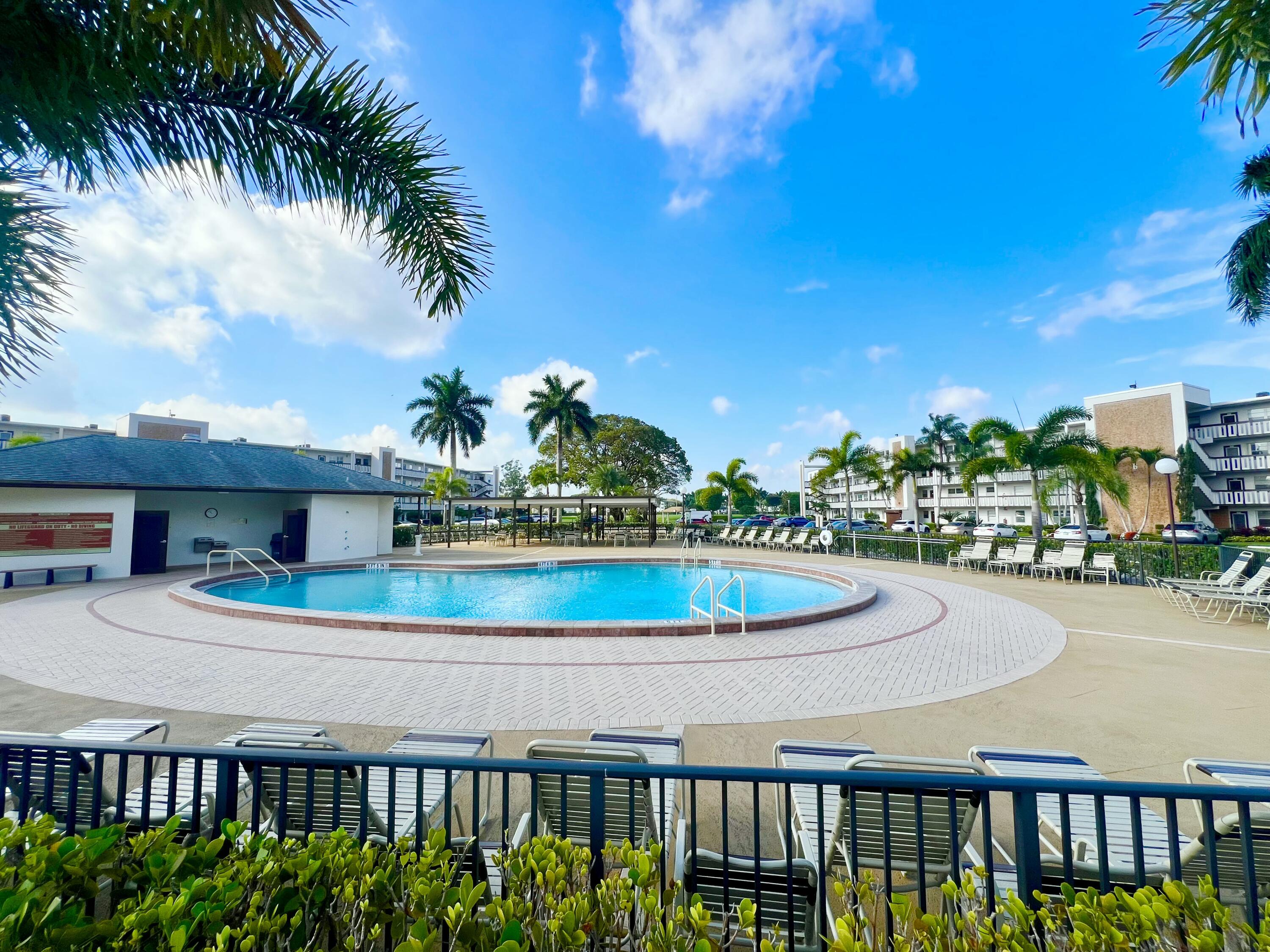 2038 Hythe A Boca Raton, FL 33434 - Photo 1 of 15 a view of a swimming pool with a patio