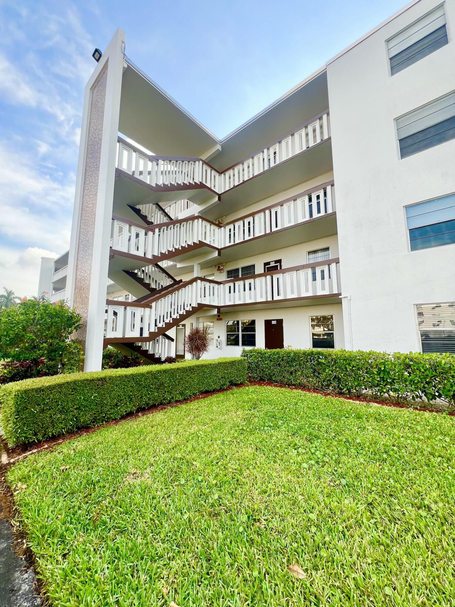 2038 Hythe A Boca Raton, FL 33434 - Photo 2 of 15 a view of building with yard