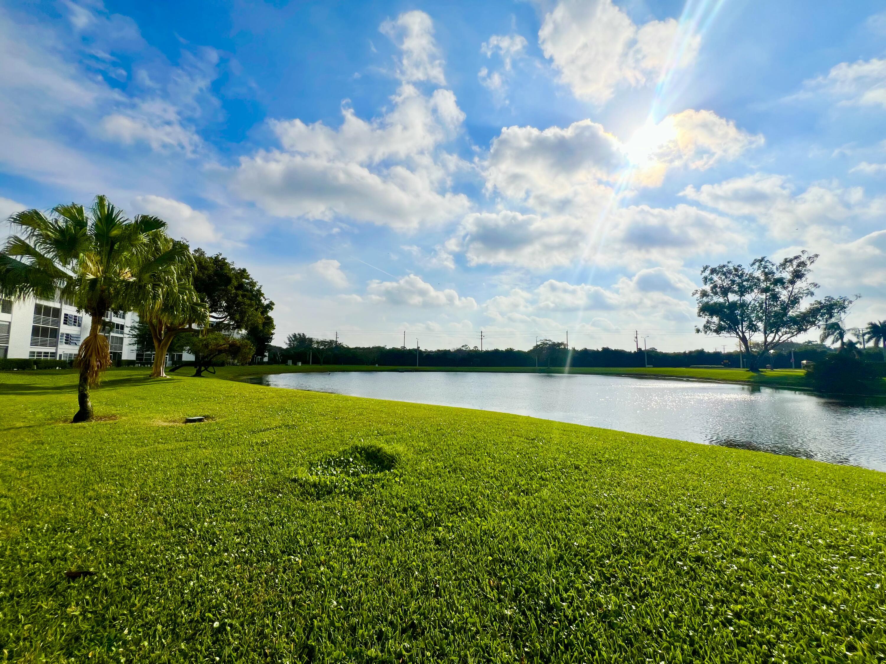 2038 Hythe A Boca Raton, FL 33434 - Photo 3 of 15 a view of a lake with houses in the back