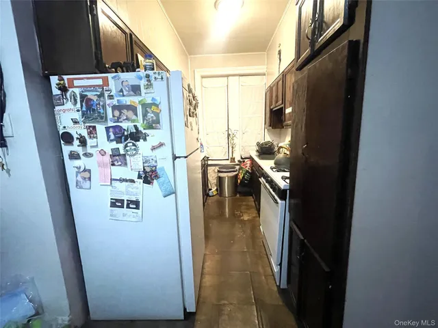 a bedroom with bed couch and window