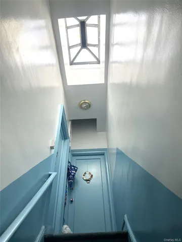 a bedroom with a bed and a television