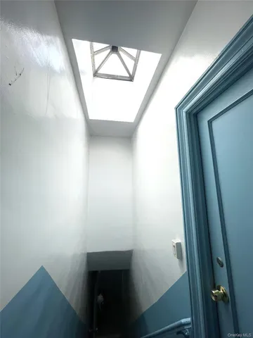 a kitchen with sink a refrigerator and windows