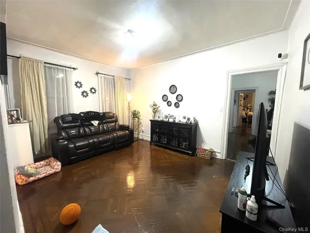 a dining room with furniture and a window