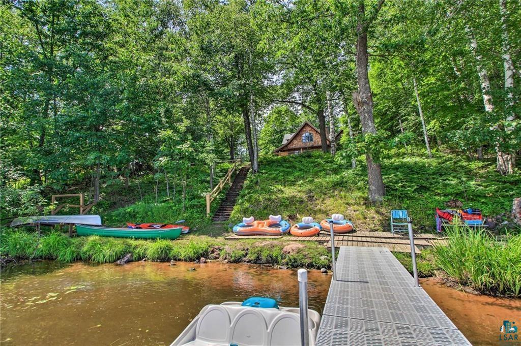 4822 East Tri Lakes Road Superior, WI 54880 - Photo 5 of 56 Surrounding community with a boat dock, a water view, and view of wooded area