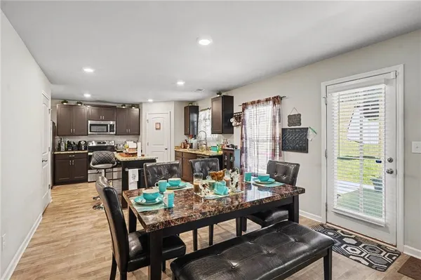 a kitchen with a stove refrigerator and a sink