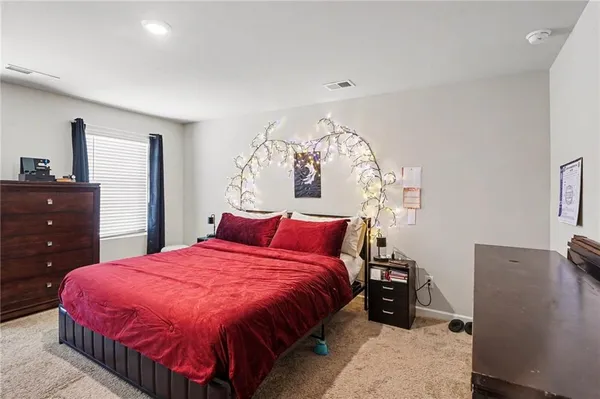 a bathroom with a sink vanity and a mirror