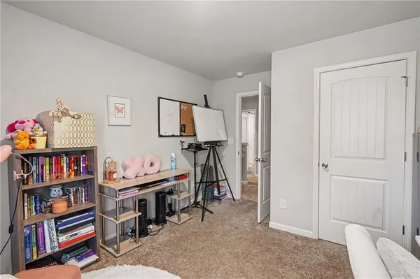 a bed room with a bed and a television