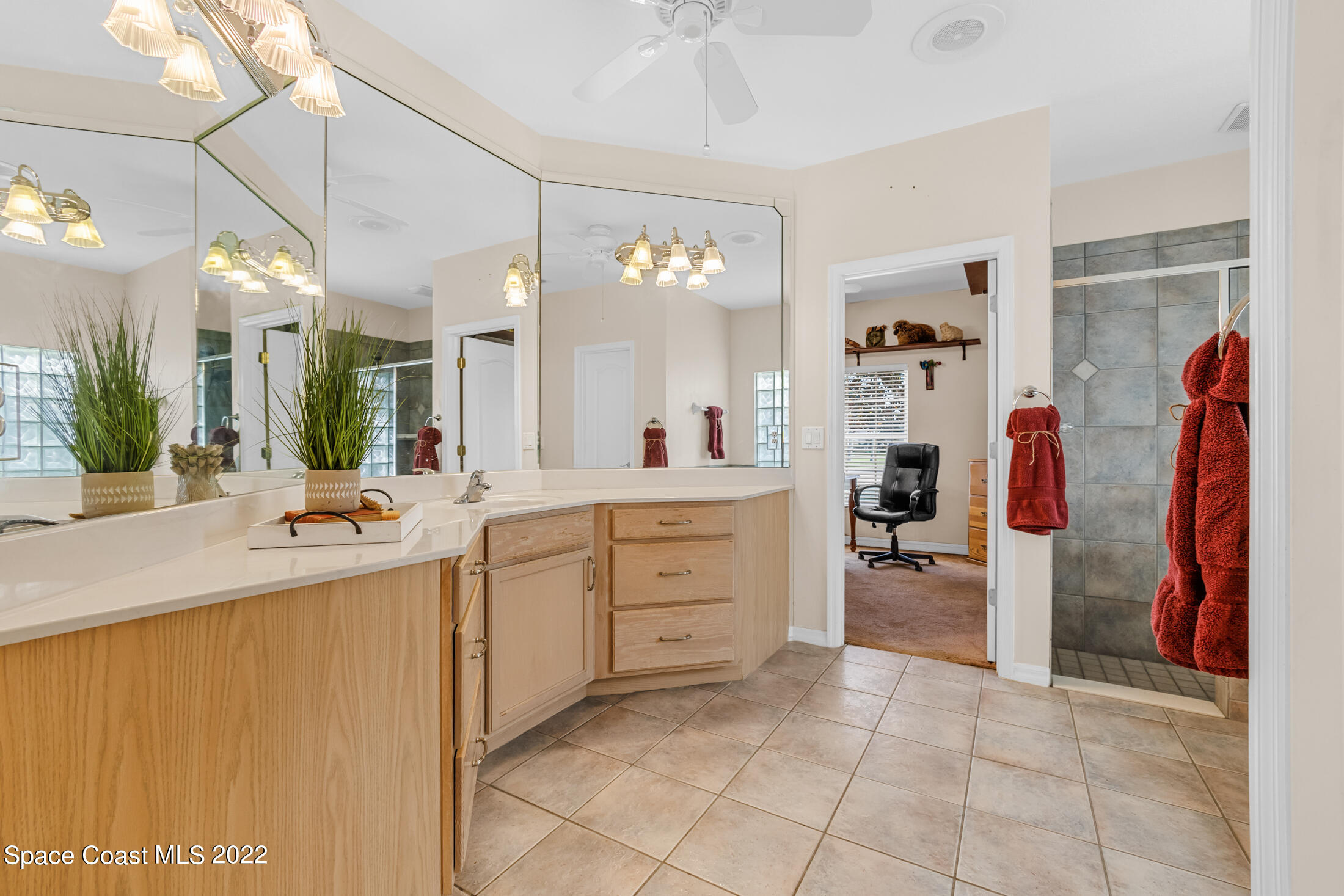 3650 Shady Run Road Melbourne, FL 32934 - Photo 18 of 43 a large white kitchen with a sink and dishwasher a refrigerator with wooden cabinets