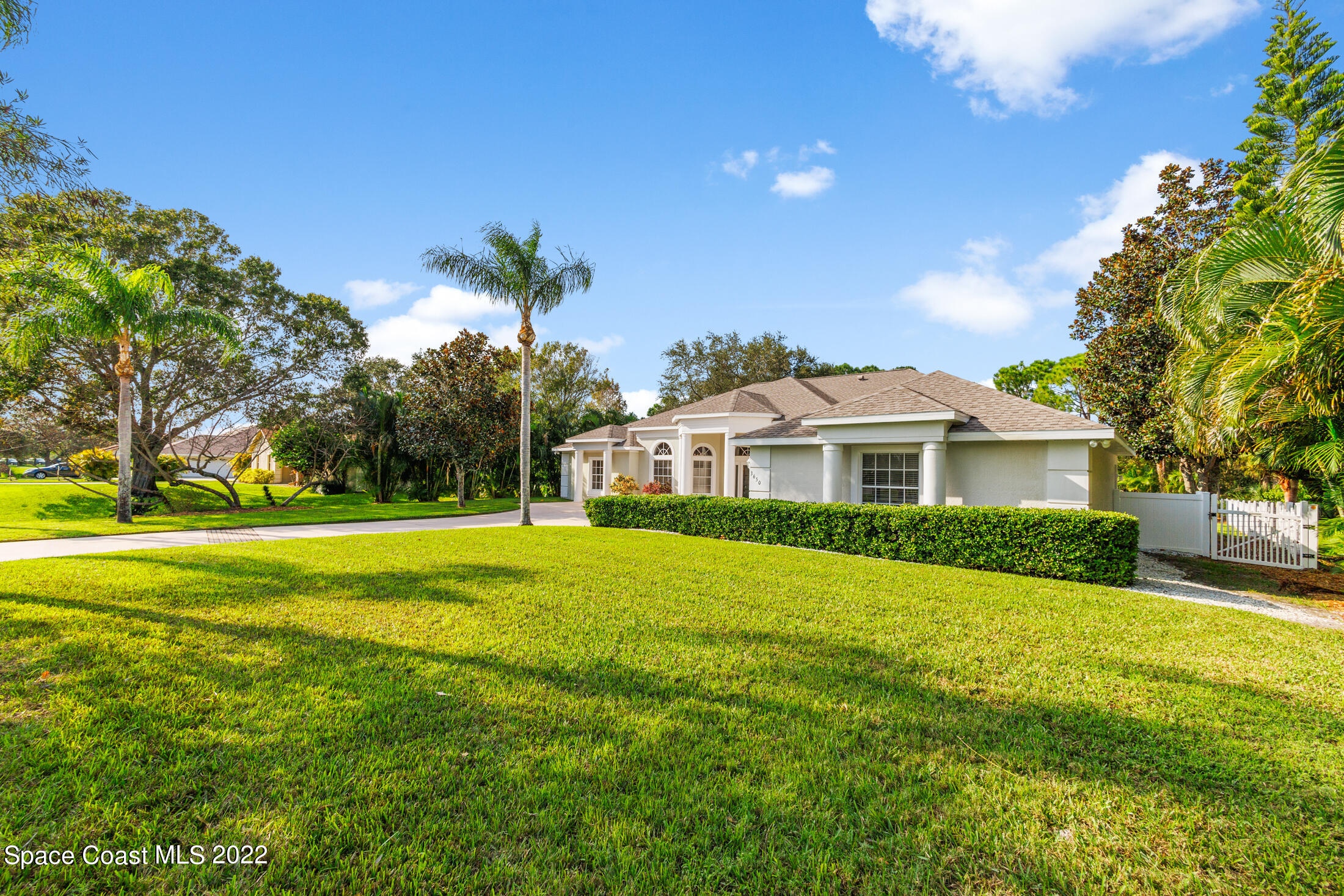 3650 Shady Run Road Melbourne, FL 32934 - Photo 3 of 43 a front view of a house with a garden