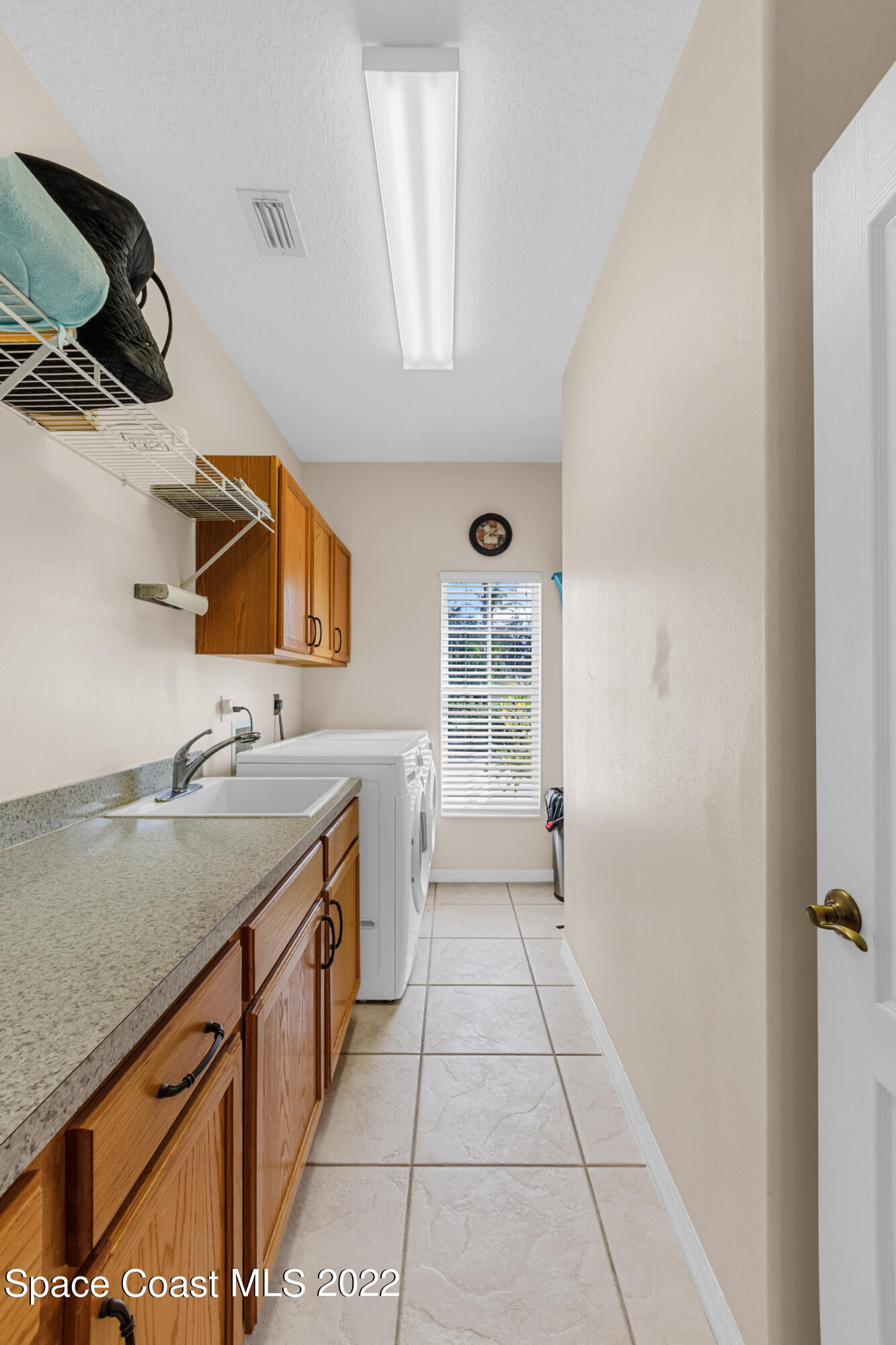 3650 Shady Run Road Melbourne, FL 32934 - Photo 34 of 43 a bathroom with a sink a vanity and mirror