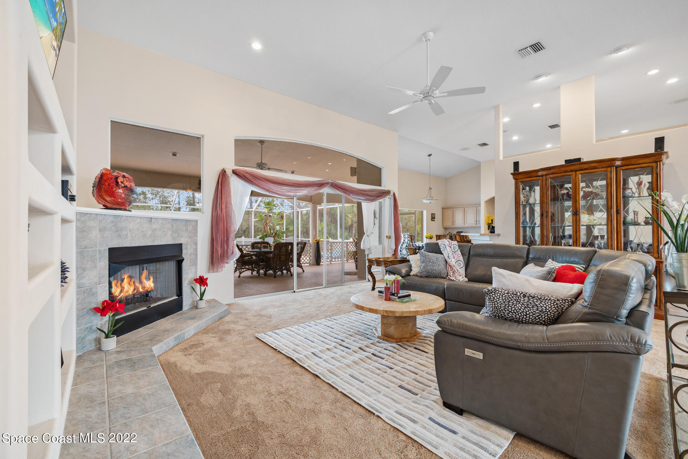 3650 Shady Run Road Melbourne, FL 32934 - Photo 7 of 43 a living room with furniture and a fireplace