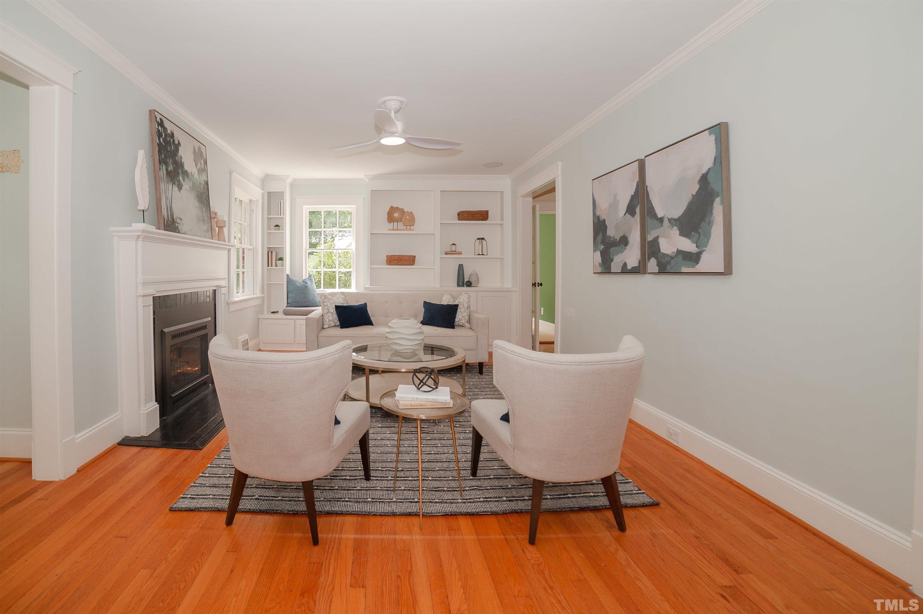 513 Gardner Street Raleigh, NC 27607 - Photo 10 of 56 a living room with furniture and a fireplace