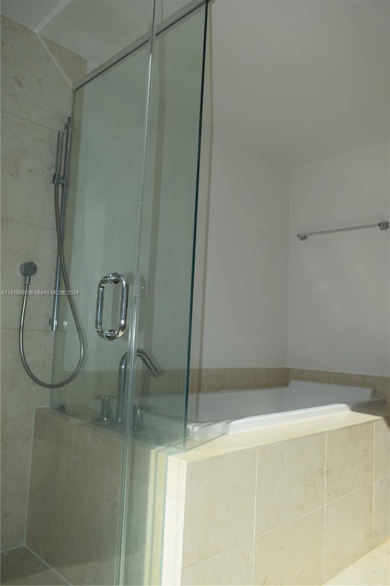 475 Brickell Avenue, Unit 4613 Miami, FL 33131 - Photo 14 of 30 a bathroom with a glass shower door