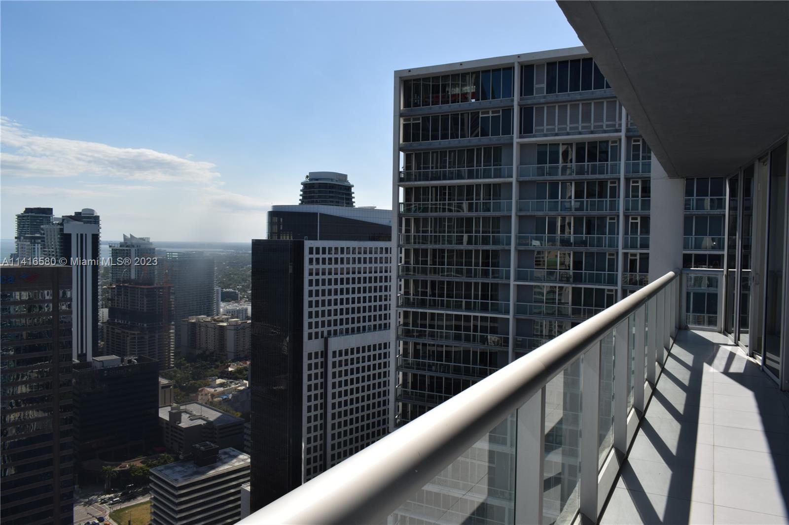 475 Brickell Avenue, Unit 4613 Miami, FL 33131 - Photo 3 of 30 a view of balcony with a couple of cars parked in front of house