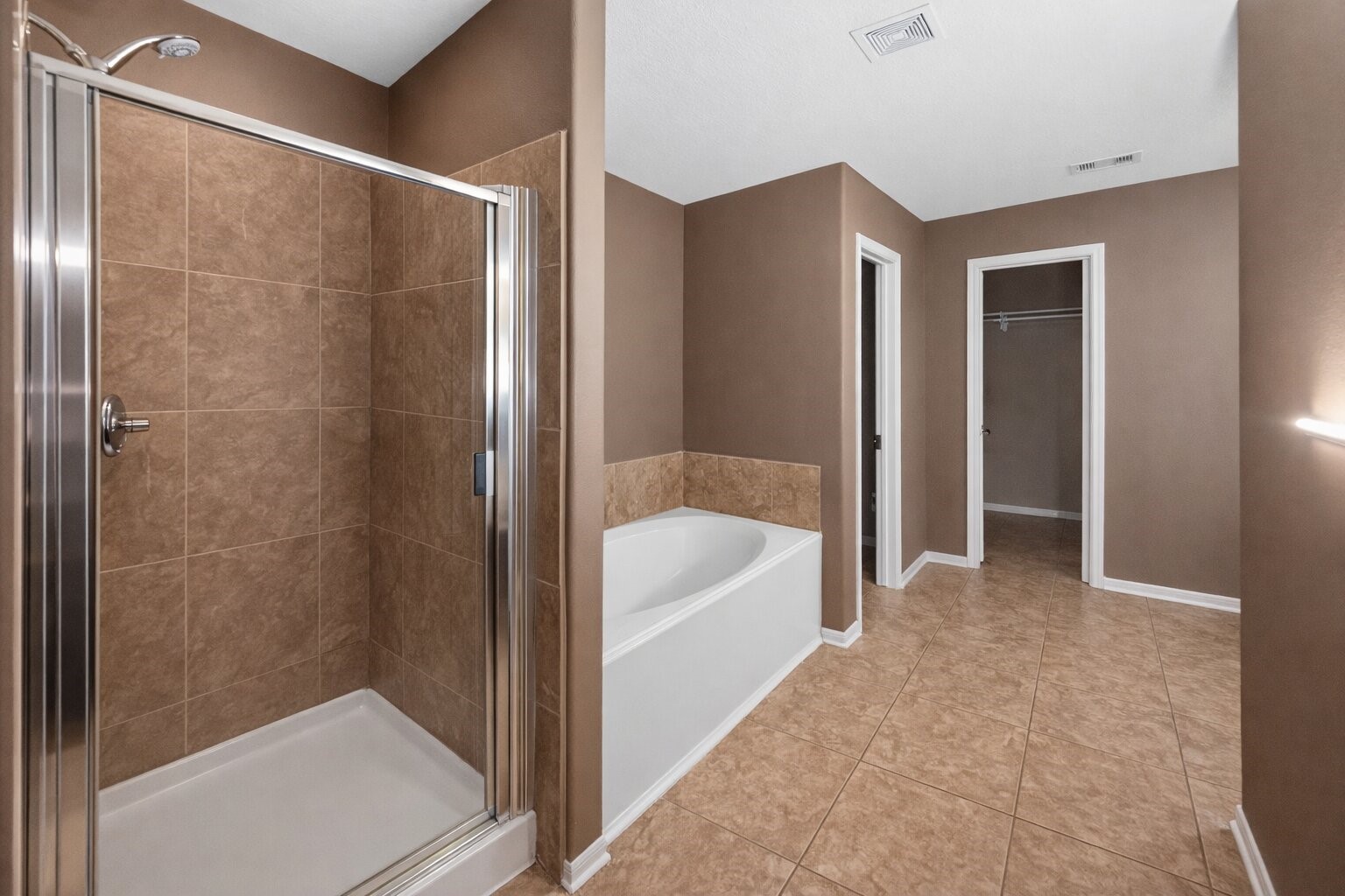 7902 Sesame Street Baytown, TX 77521 - Photo 17 of 24 a bathroom with a bathtub and a shower
