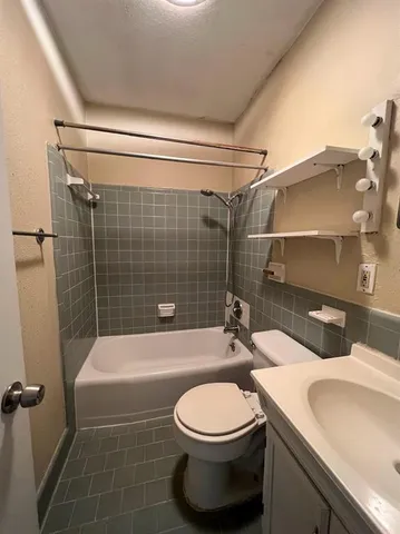 an empty room with wooden floor and closet