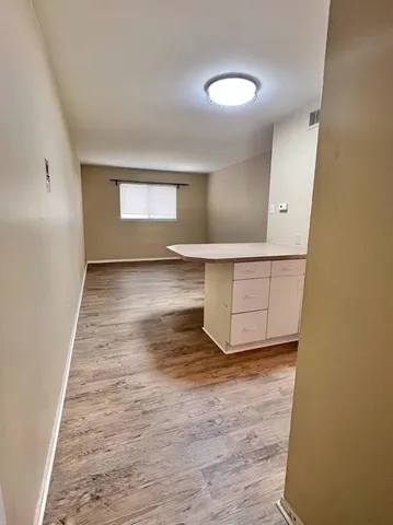 a sign that is on the side of a brick building