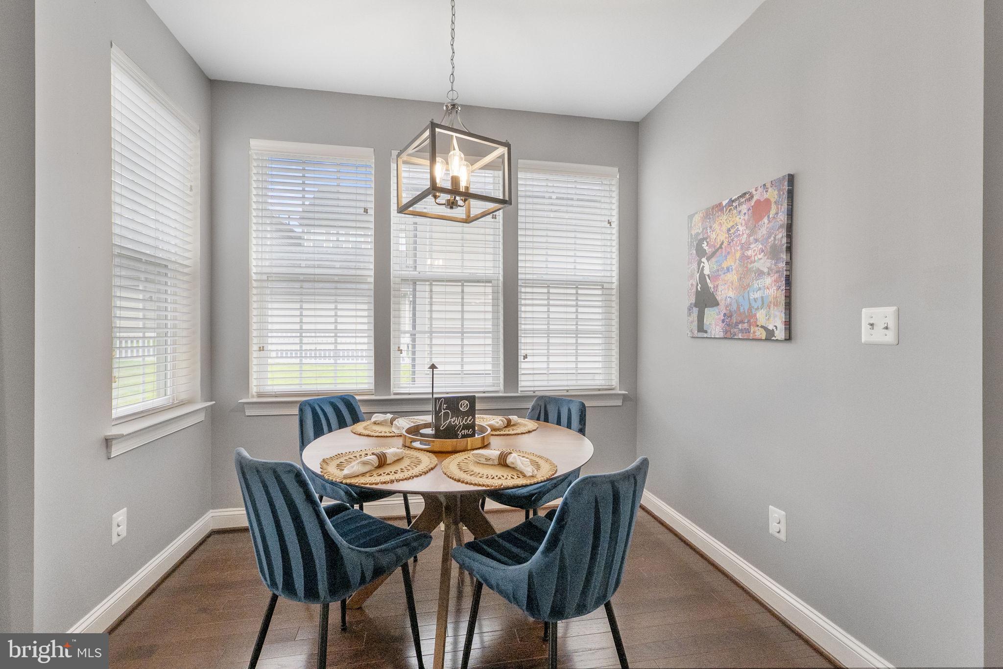 23902 Grapevine Ridge Terrace Clarksburg, MD 20871 - Photo 13 of 44 a view of a dining room with furniture window and outside view