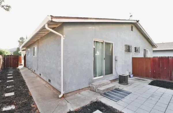 a front view of a house with fence