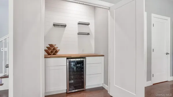 a kitchen with stainless steel appliances a refrigerator and microwave
