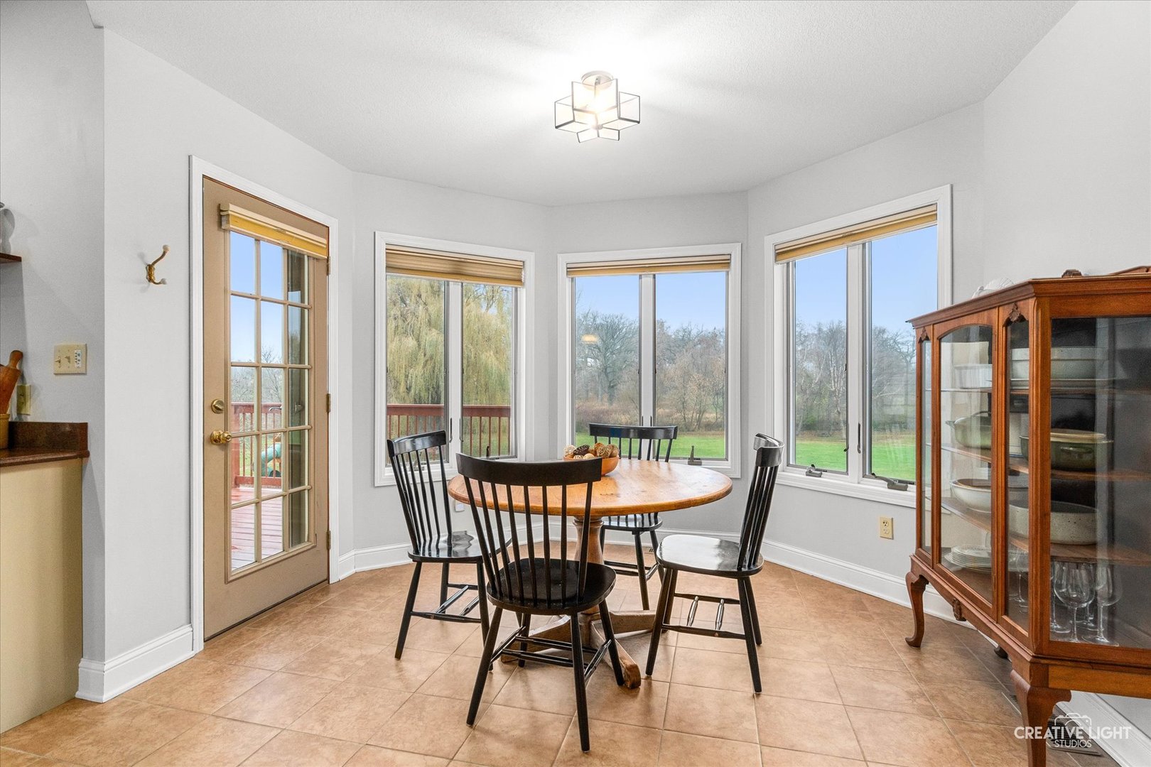 10167 East Deer Creek Lane Rochelle, IL 61068 - Photo 14 of 51 a dining room with furniture and windows