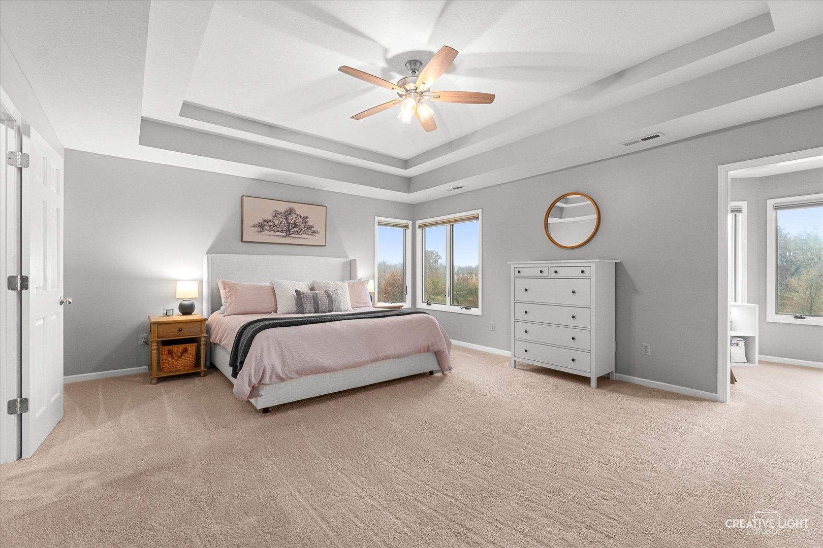 10167 East Deer Creek Lane Rochelle, IL 61068 - Photo 25 of 51 a spacious bedroom with a bed and a chandelier