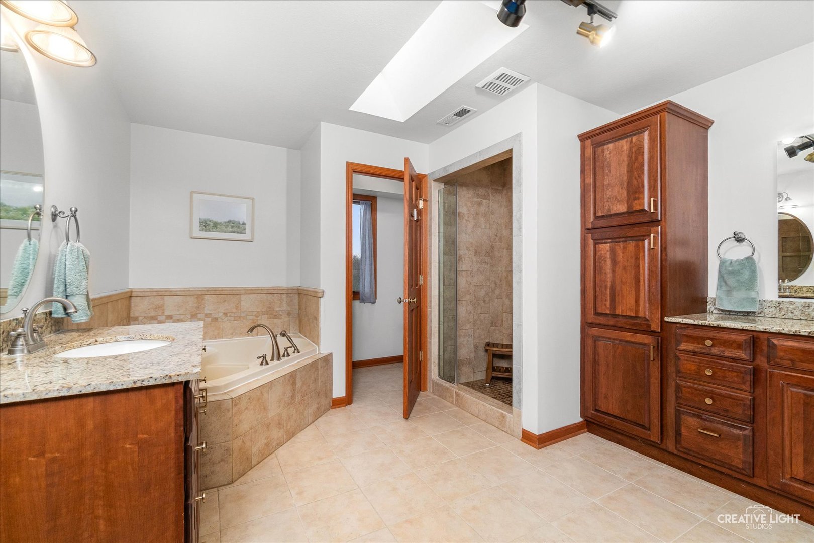 10167 East Deer Creek Lane Rochelle, IL 61068 - Photo 29 of 51 a spacious bathroom with a tub sink and mirror