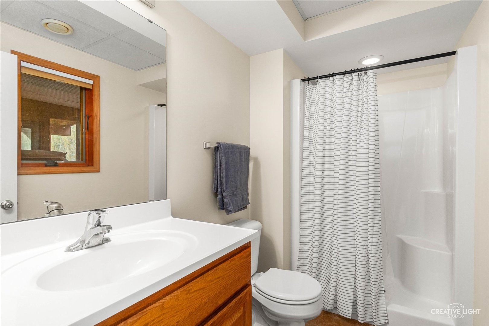 10167 East Deer Creek Lane Rochelle, IL 61068 - Photo 42 of 51 a bathroom with a sink toilet and shower