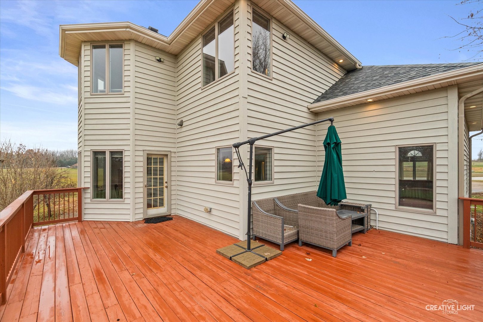 10167 East Deer Creek Lane Rochelle, IL 61068 - Photo 45 of 51 a backyard of a house with wooden floor and fence
