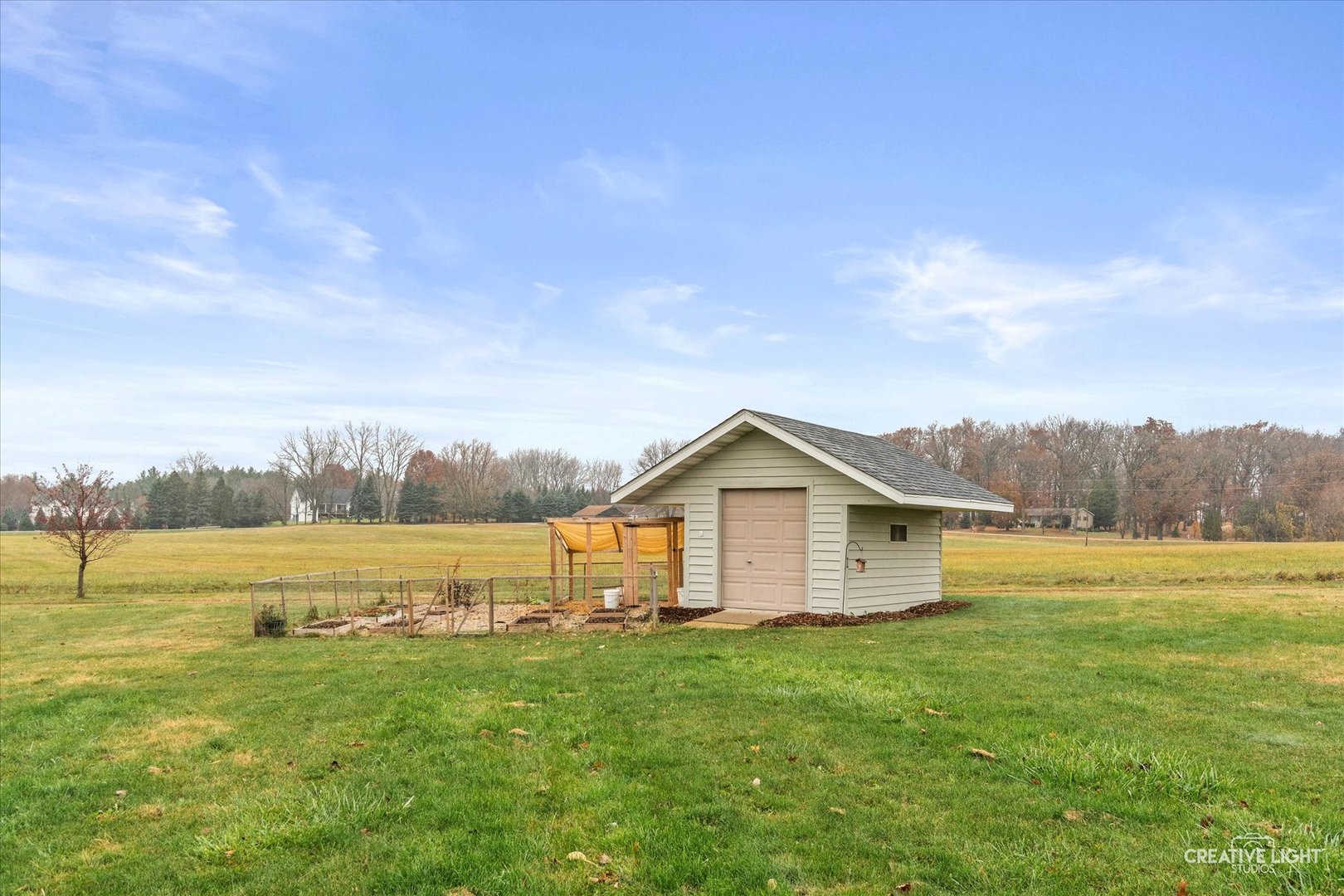 10167 East Deer Creek Lane Rochelle, IL 61068 - Photo 48 of 51 a front view of a house with a yard and lake view