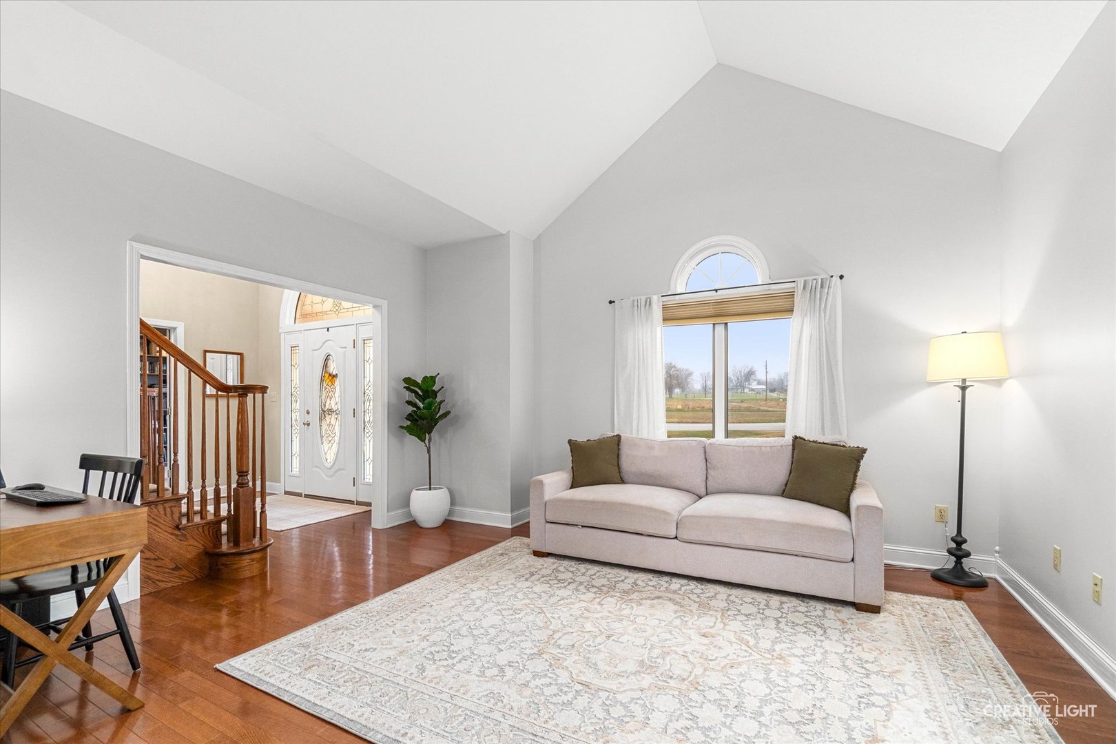 10167 East Deer Creek Lane Rochelle, IL 61068 - Photo 6 of 51 a living room with furniture and wooden floor